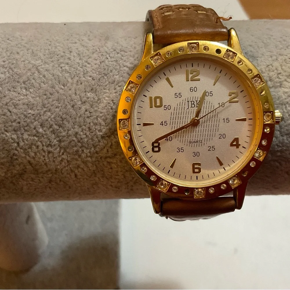 Seiko: men’s but unisex Camrose, Kross Jackie Onassis collection leather watch.